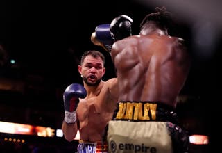 Endry Saavedra (left) bearing down on Denzel Bentley